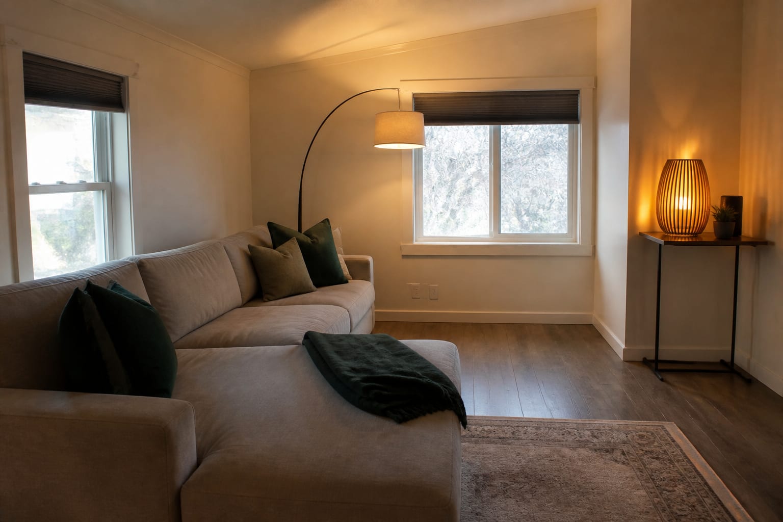 living room photo prepared for AI redesign with visible sofa, window, rug edge, floor color, and awkward corner constraints