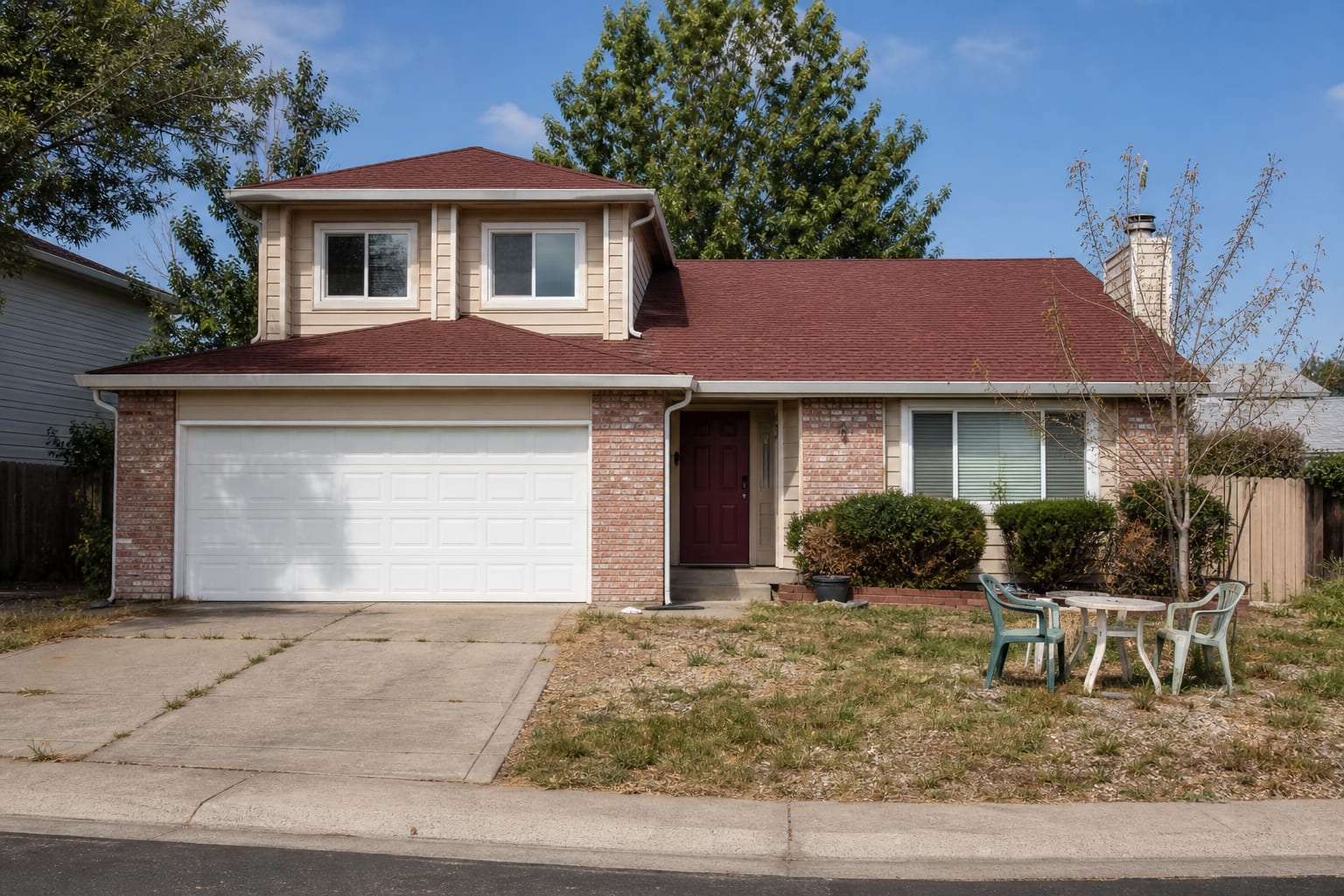 dated beige house exterior with orange brick, white garage door, thin trim, and a faded burgundy front door