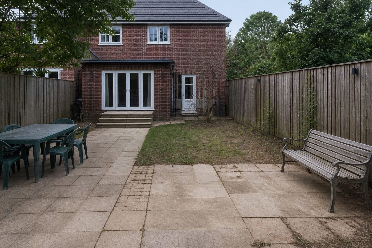 Dark bare side garden before a layered shade garden redesign