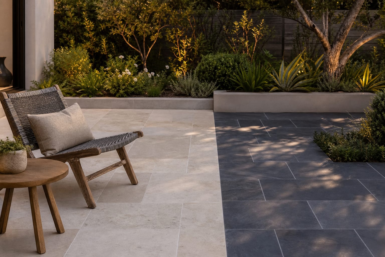 limestone and bluestone patio samples shown in sun and shade beside outdoor chairs and planting beds