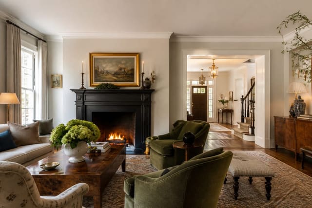 Editorial interior design photograph showing traditional vs transitional design explained in a real whole home, with grandmillennial materials, layered warm lighting, styled furniture, and a magazine-quality residential composition.