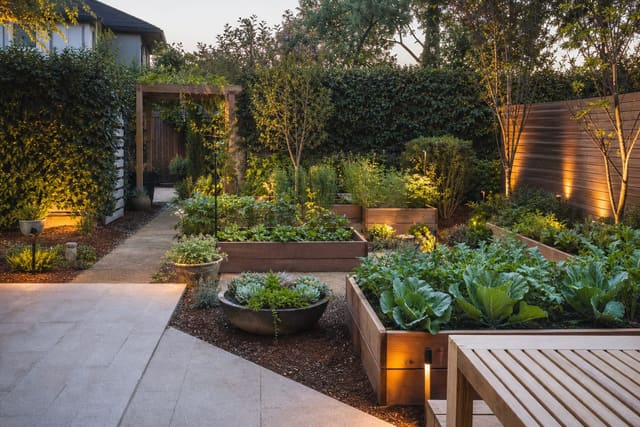 Vegetable Garden Design Ideas: Kitchen Garden Layouts That Actually Work shown as a photorealistic outdoor redesign with layered materials, planting, lighting, and clear circulation